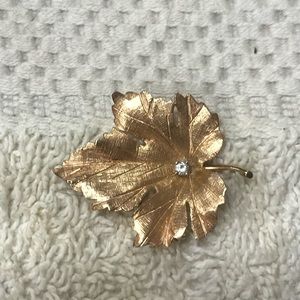 Gold, 14 karat, pin with small diamond.